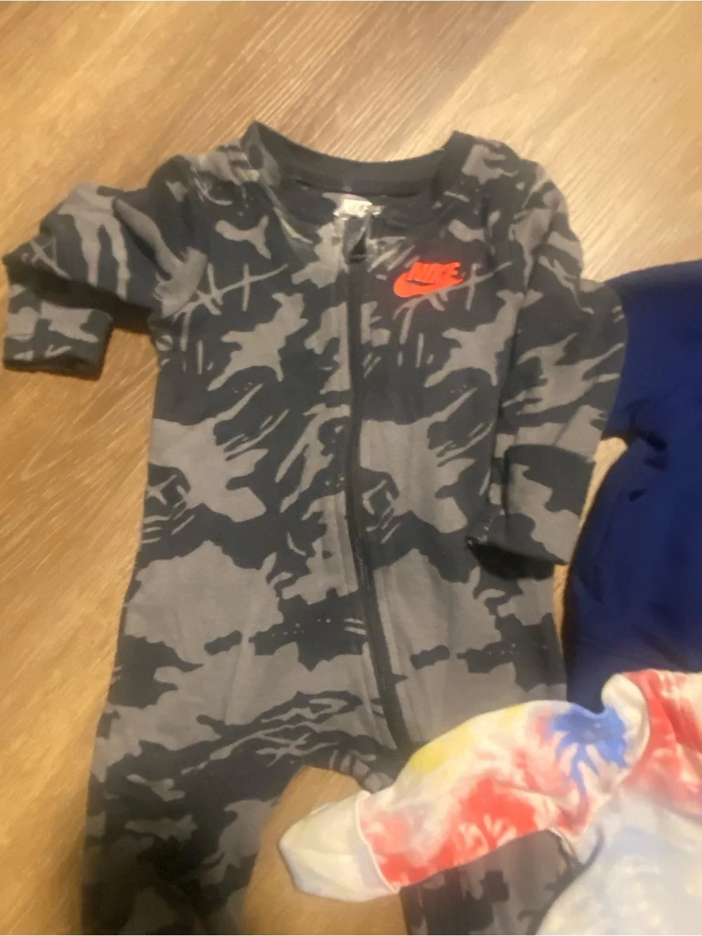 3 Nike Kids Tie-Dye Zip Front Footed One-Piece and 1 navy Nike Zip-Up Jacket